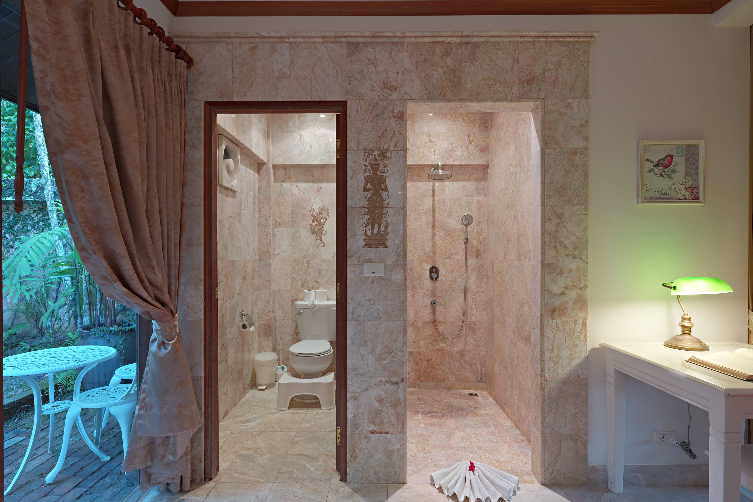 Walk-in shower opening onto a private garden